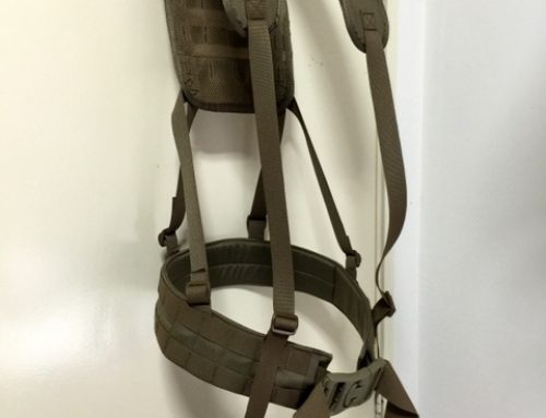 Load bearing harness with survival pouch